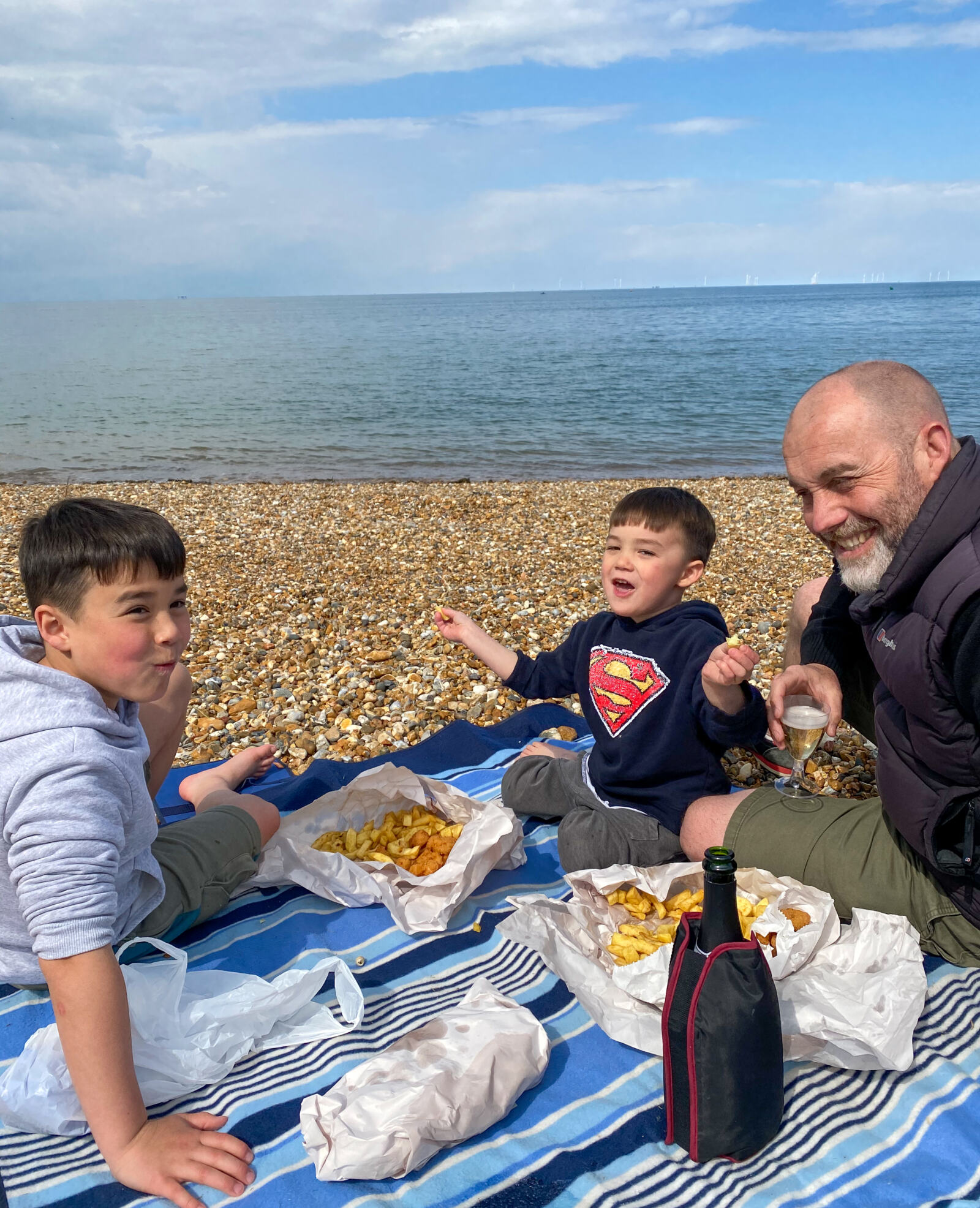 easting Ossies fish and chips on Whitstable Beach - My Travel Monkey