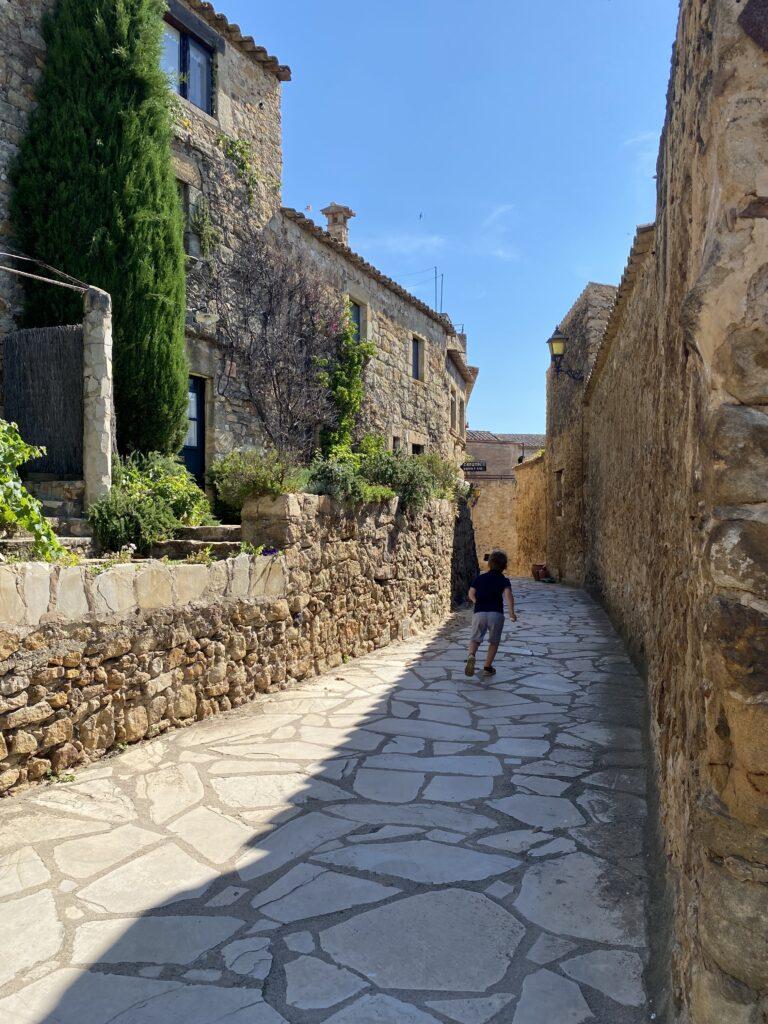 Running through the cobbled streets of Pals old quarter