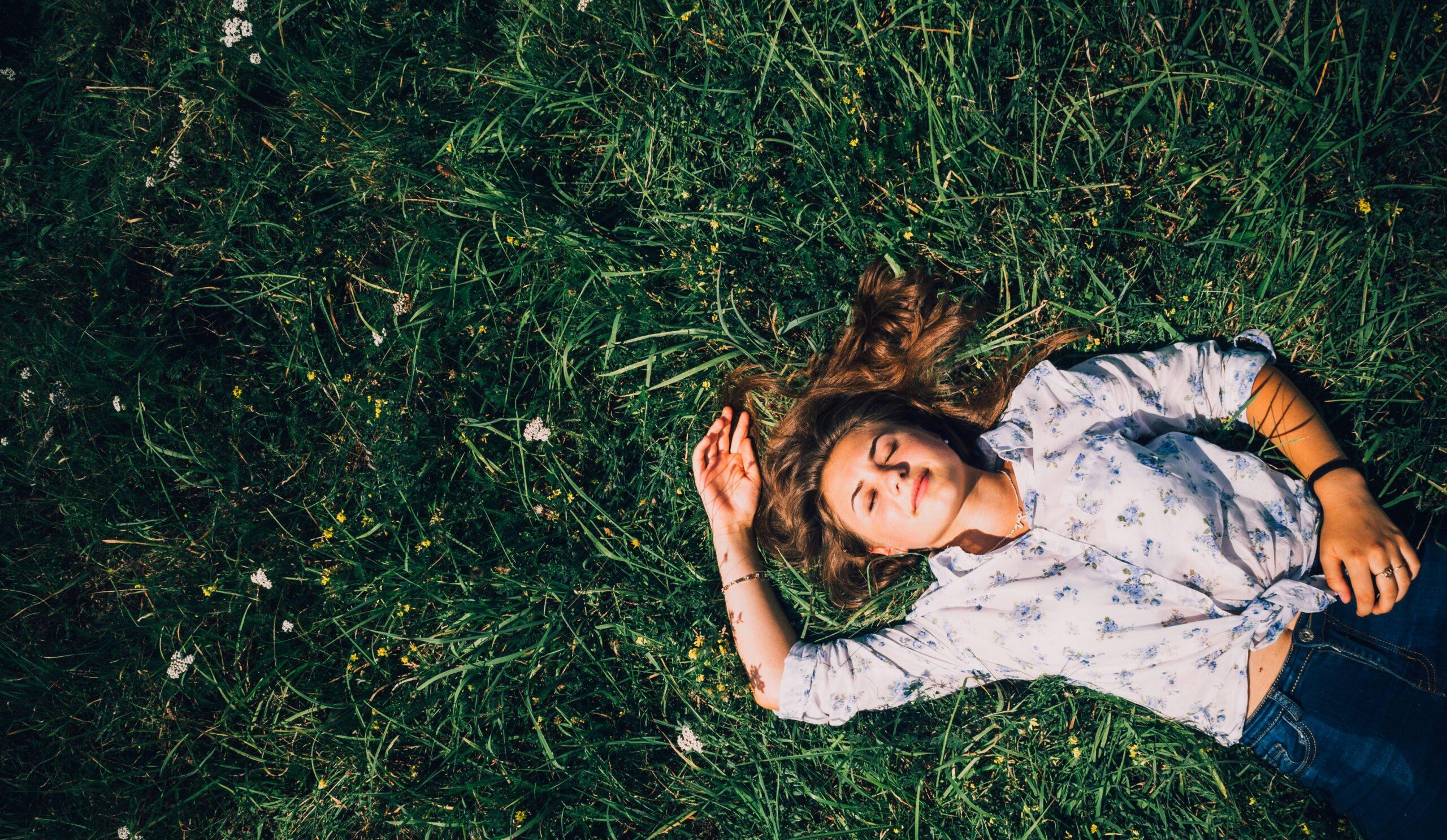 woman sleeping on the grass - my travel monkey