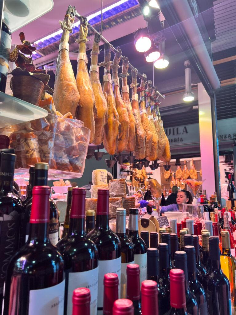 Jamon and wine in Granada food market - My Travel Monkey
