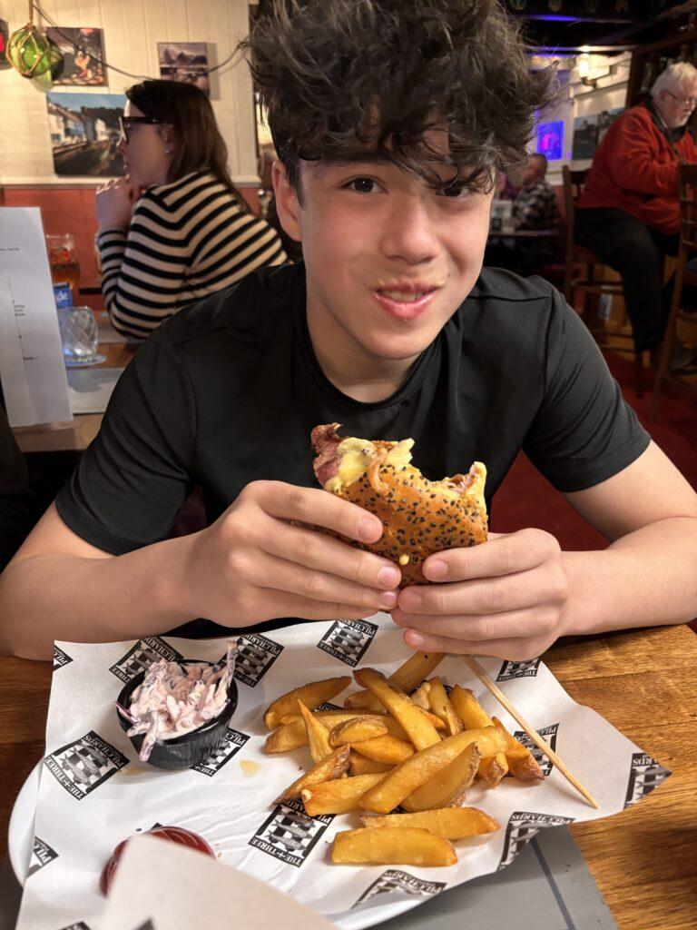 Eating a burger at The Three Pilchards - My Travel Monkey