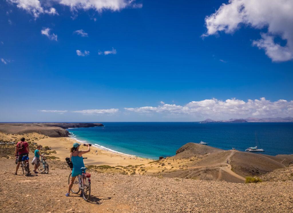 Cyclists admiring Papagayo beach view-Lanzarote-My Travel Monkey
