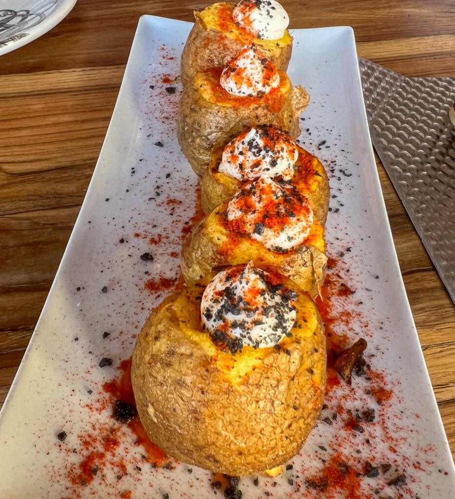 Patatas bravas filled with aioli - My Travel Monkey
